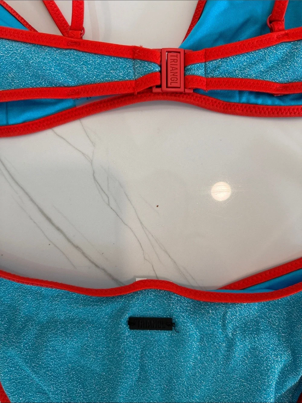 triangl swimwear turquoise bikini with red trim